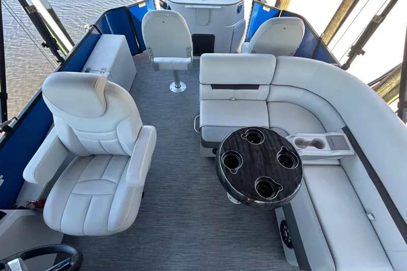 Slide: The Image of Interior of 2022 Godfrey Sweetwater 2286FS boat with plush seating and cup holders. - 46