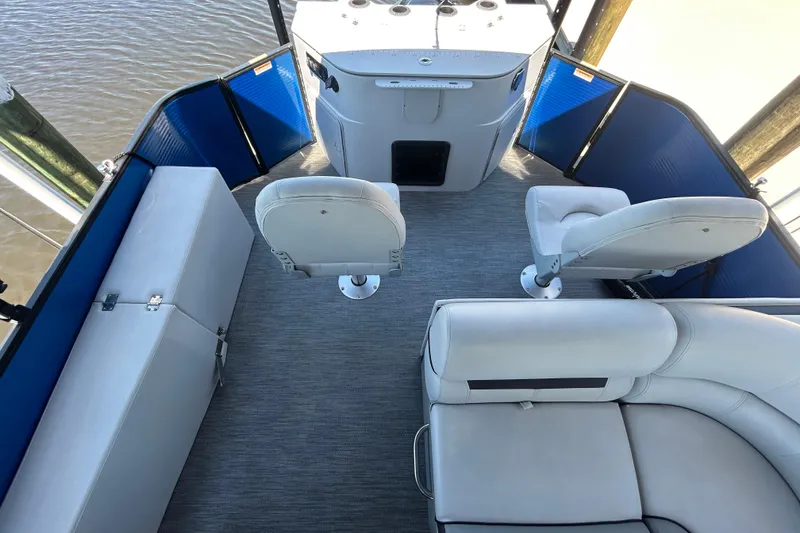Slide: The Image of Interior of 2022 Godfrey Sweetwater 2286FS pontoon boat with seating and helm. - 48