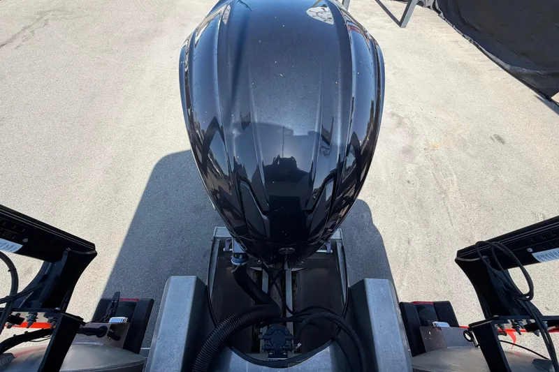 Slide: The Image of Top view of a 2022 Godfrey Sweetwater 2286FS boat engine on pavement. - 63