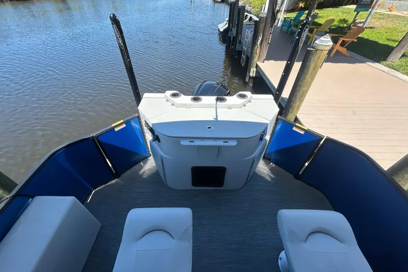 Slide: The Image of 2022 Godfrey Sweetwater 2286FS pontoon boat interior with seating and water view. - 51