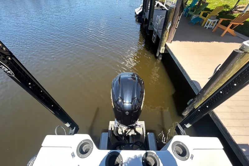 Slide: The Image of Aerial view of 2022 Godfrey Sweetwater 2286FS boat docked by a wooden pier. - 53