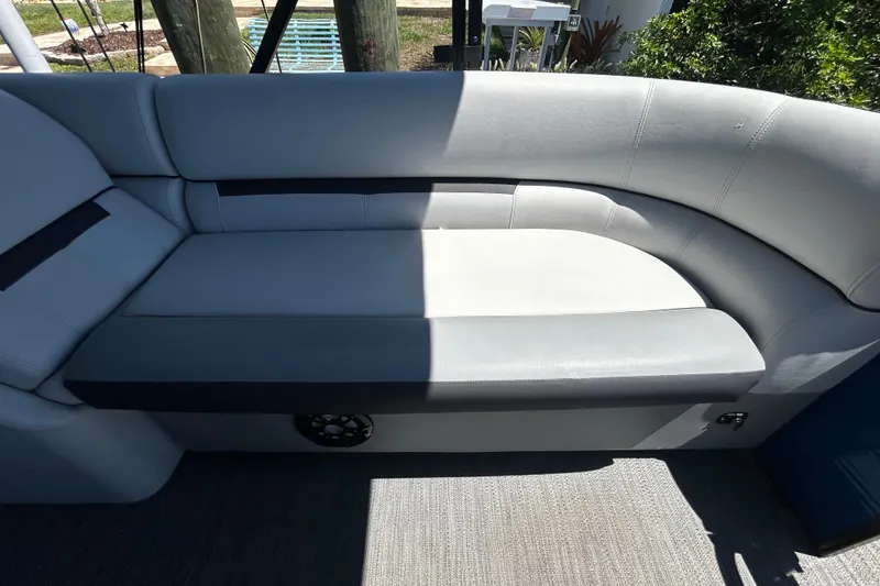 Slide: The Image of 2022 Godfrey Sweetwater 2286FS boat interior with gray cushioned seating. - 55
