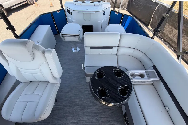 Slide: The Image of Interior of a 2022 Godfrey Sweetwater 2286FS with white seating and a round table. - 36