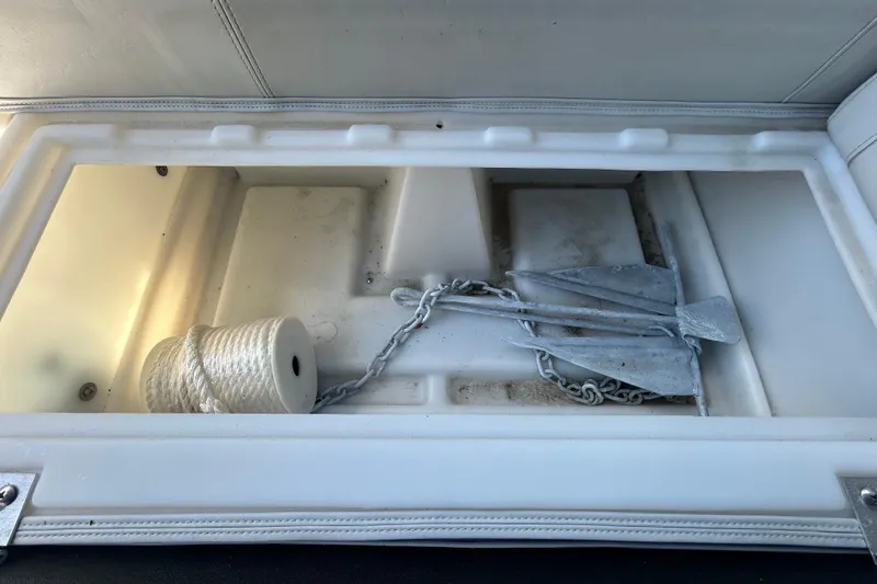 Slide: The Image of Storage compartment with anchor and rope on 2022 Godfrey Sweetwater 2286FS boat. - 65