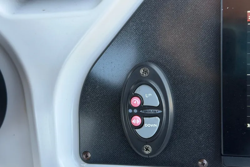 Slide: The Image of Control panel on a 2022 Godfrey Sweetwater 2286FS boat with up and down buttons. - 33