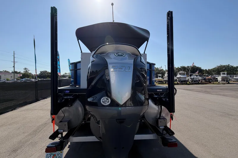 Slide: The Image of Rear view of 2022 Godfrey Sweetwater 2286FS boat with powerful outboard motor. - 2