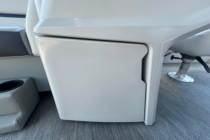 Slide: The Image of Interior view of a 2022 Godfrey Sweetwater 2286FS boat, featuring a storage compartment. - 69