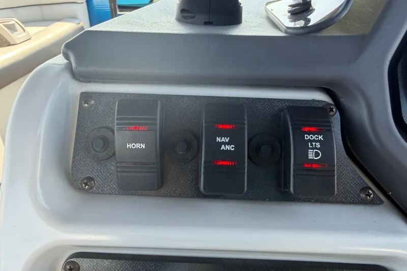 Slide: The Image of Control panel of 2022 Godfrey Sweetwater 2286FS with horn, navigation, and dock light switches. - 27
