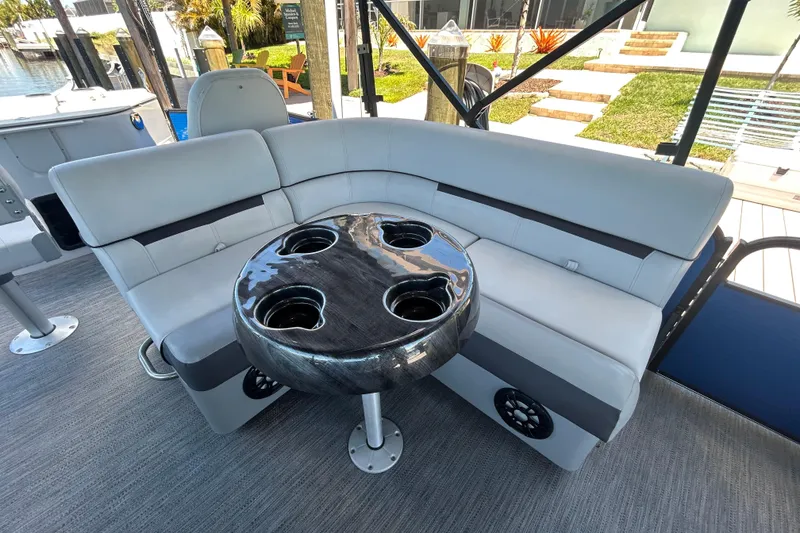 Slide: The Image of Luxurious seating area on 2022 Godfrey Sweetwater 2286FS boat with cup holders. - 72