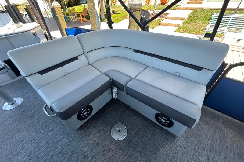 Slide: The Image of 2022 Godfrey Sweetwater 2286FS boat interior with gray cushioned seating. - 73