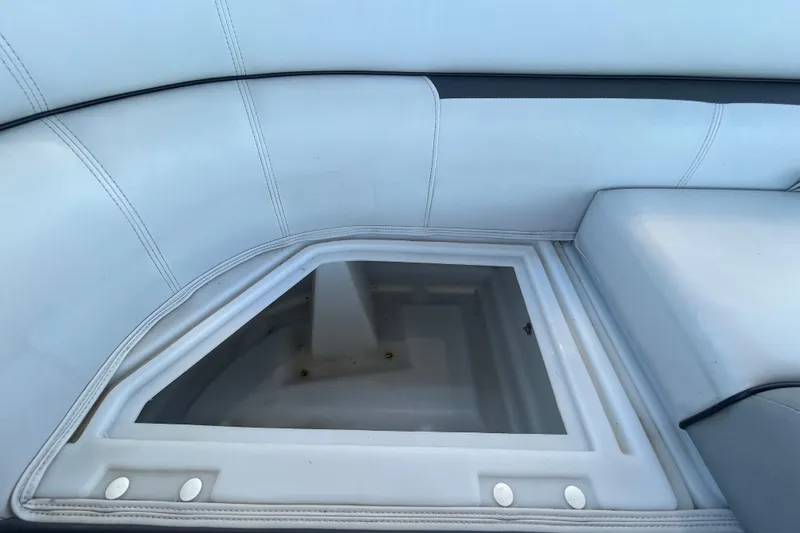 Slide: The Image of Interior seating of 2022 Godfrey Sweetwater 2286FS boat with storage compartment. - 78
