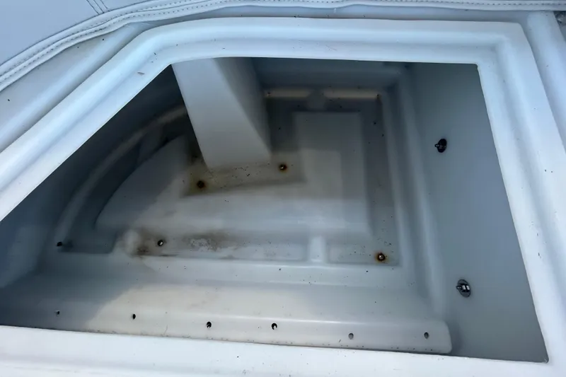 Slide: The Image of Storage compartment of 2022 Godfrey Sweetwater 2286FS boat, showing interior details. - 79