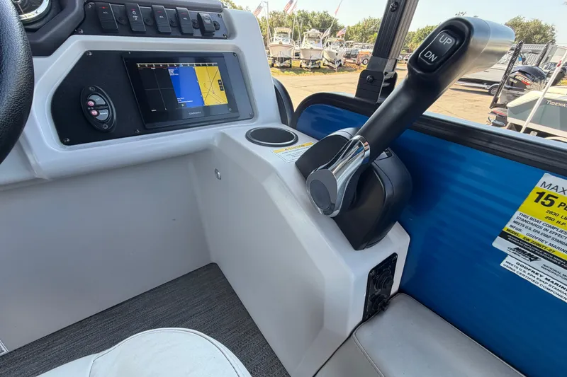 Slide: The Image of Control panel of 2022 Godfrey Sweetwater 2286FS boat with navigation screen and throttle. - 35