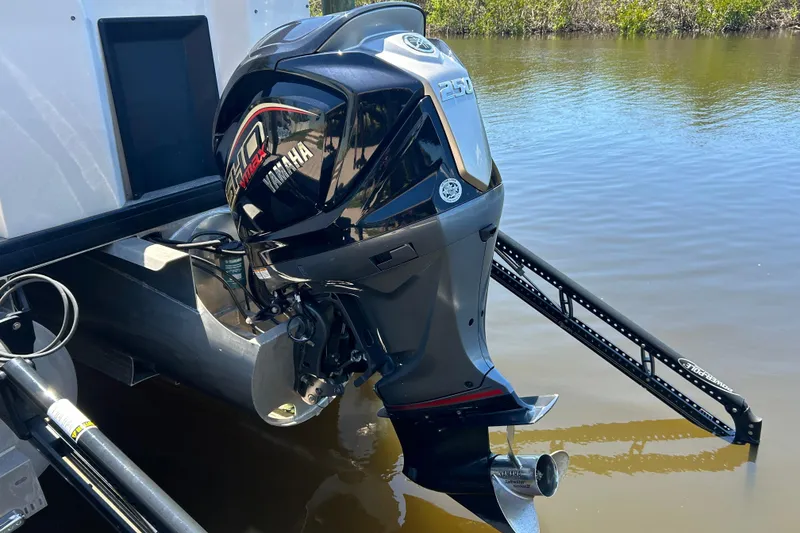Slide: The Image of Yamaha outboard motor on 2022 Godfrey Sweetwater 2286FS pontoon boat in calm water. - 8