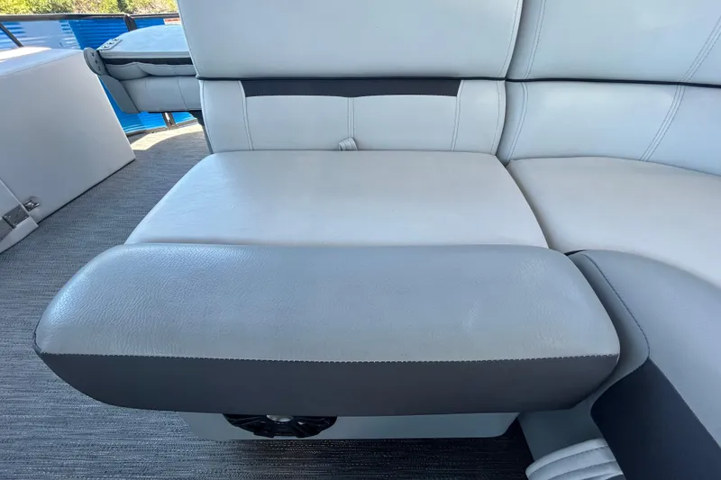 Slide: The Image of 2022 Godfrey Sweetwater 2286FS boat interior with gray cushioned seating. - 80