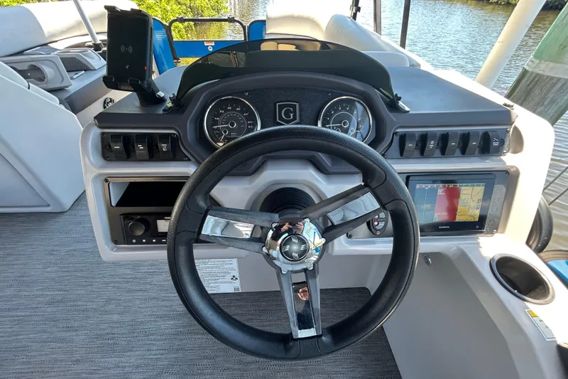 Slide: The Image of Steering console of 2022 Godfrey Sweetwater 2286FS boat with navigation display. - 84