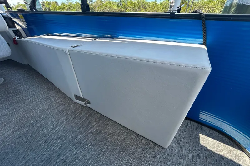 Slide: The Image of Interior seating of 2022 Godfrey Sweetwater 2286FS boat with blue paneling. - 88