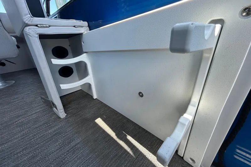 Slide: The Image of Interior view of 2022 Godfrey Sweetwater 2286FS boat, featuring seating and storage compartments. - 90