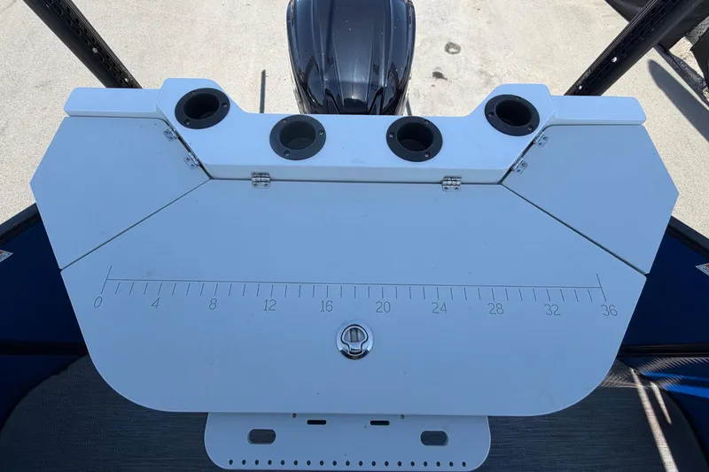 Slide: The Image of The image shows a white boat accessory with cup holders and a measurement scale. - 46