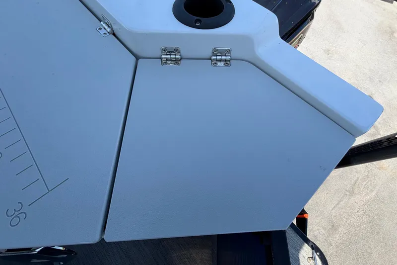 Slide: The Image of Close-up of a boat deck with hinges and a cup holder. - 50