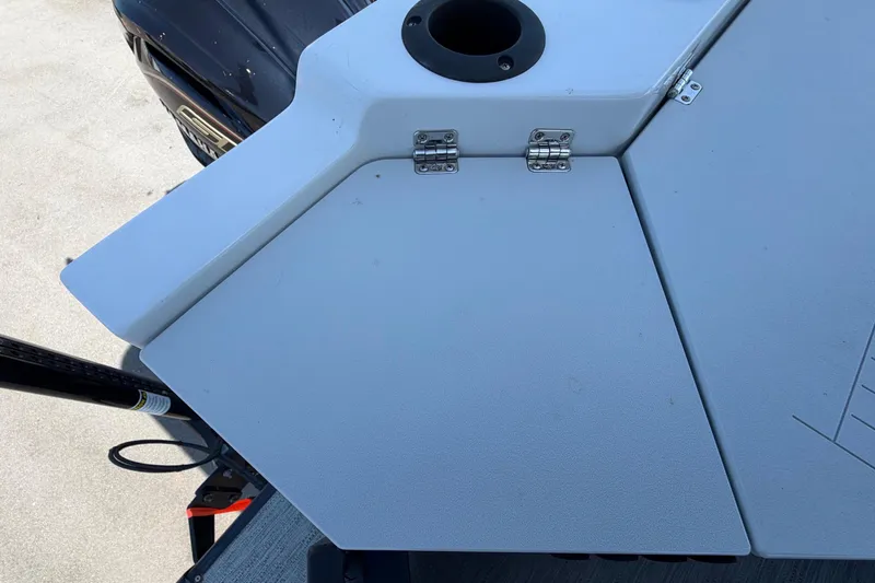 Slide: The Image of Close-up of a white boat section with hinges and a round hole. - 48