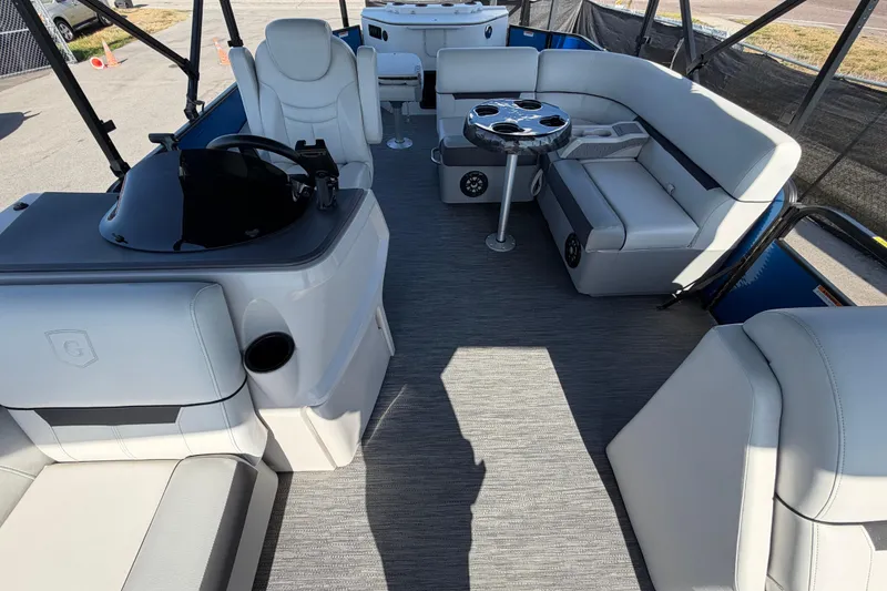 Slide: The Image of Interior of 2022 Godfrey Sweetwater 2286FS pontoon boat with plush seating and table. - 20