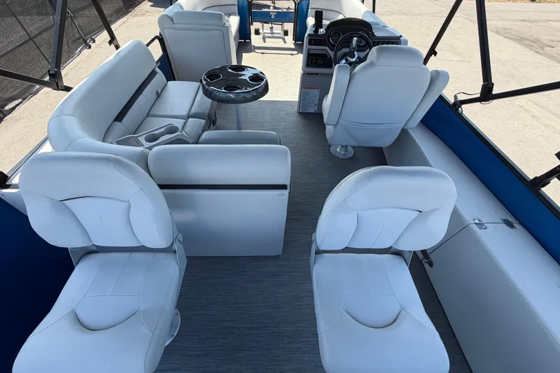 Slide: The Image of Interior of 2022 Godfrey Sweetwater 2286FS pontoon boat with white seating and table. - 66