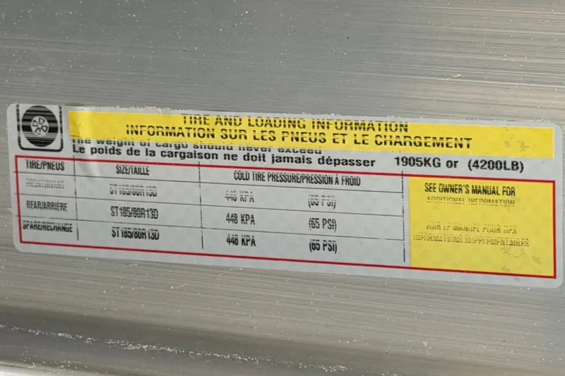 Slide: The Image of Tire and loading information label on 2022 Godfrey Sweetwater 2286FS boat. - 81
