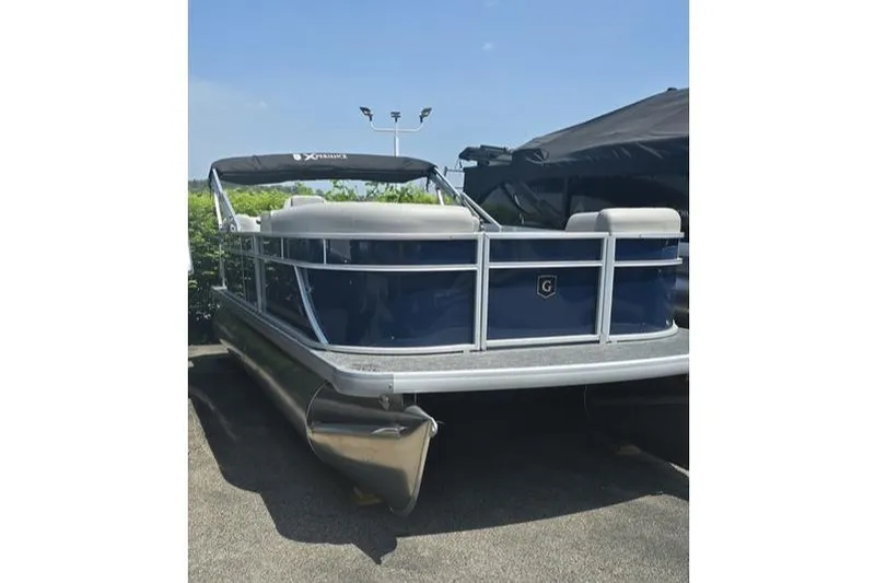 The Image of 2025 Godfrey EX 2086 SBX pontoon boat with blue exterior and canopy. - 0