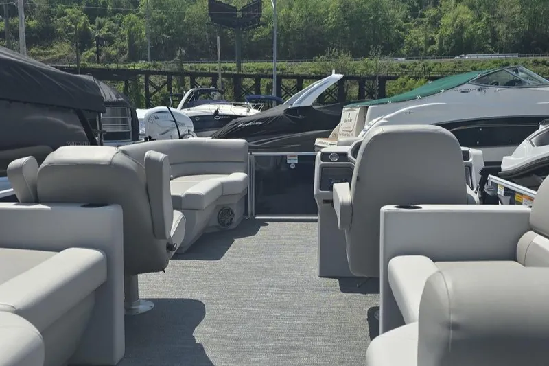 Slide: The Image of Interior of 2025 Godfrey EX 2086 SBX pontoon boat with plush seating and modern design. - 2