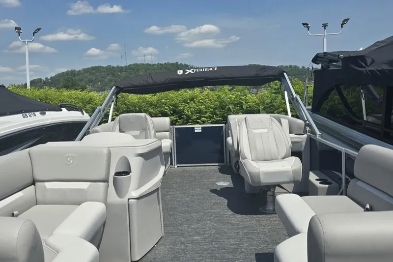 Slide: The Image of 2025 Godfrey EX 2086 SBX pontoon boat with spacious seating and modern design. - 4