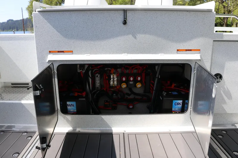 Slide: The Image of Electrical compartment of 2026 KingFisher 3425 GFX Offshore boat with open access panel. - 32