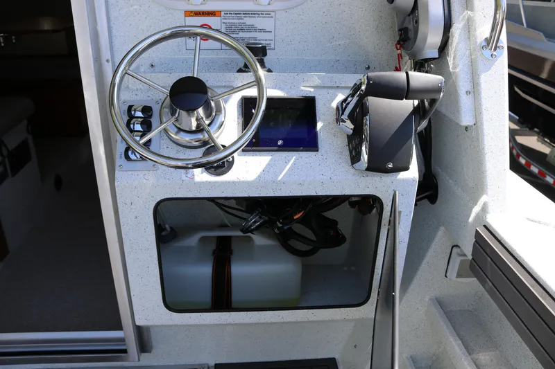 Slide: The Image of Helm of 2026 KingFisher 3425 GFX Offshore boat with steering wheel and controls. - 26