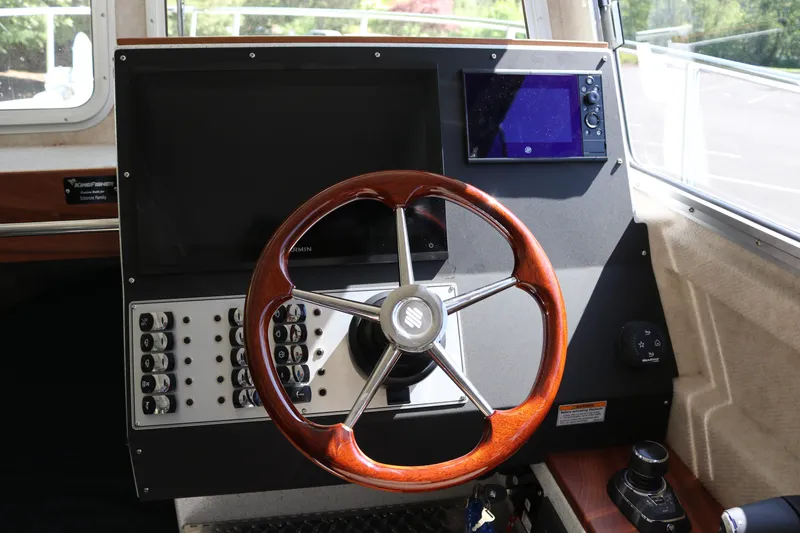 Slide: The Image of Steering wheel and dashboard of 2026 KingFisher 3425 GFX Offshore boat. - 7