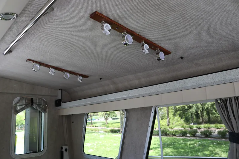 Slide: The Image of Interior ceiling of 2026 KingFisher 3425 GFX Offshore boat with modern lighting fixtures. - 22