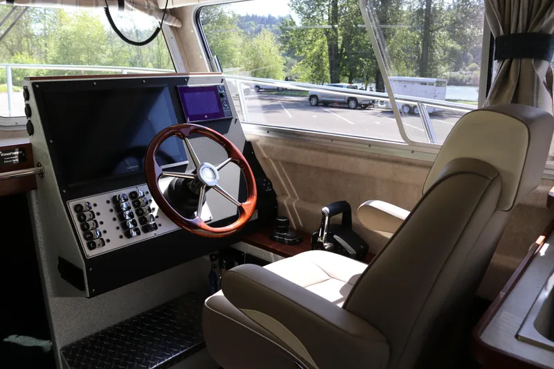 Slide: The Image of Interior of 2026 KingFisher 3425 GFX Offshore boat with steering wheel and control panel. - 5