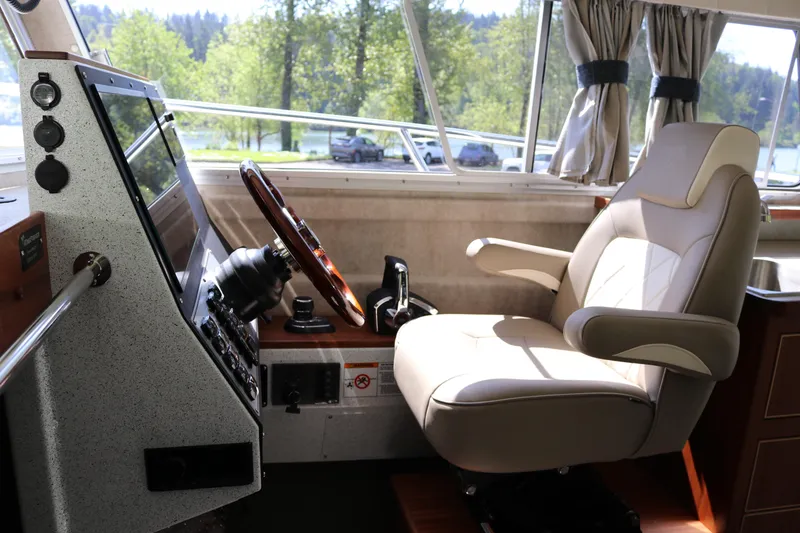 Slide: The Image of Captain's chair and helm of 2026 KingFisher 3425 GFX Offshore boat interior. - 9
