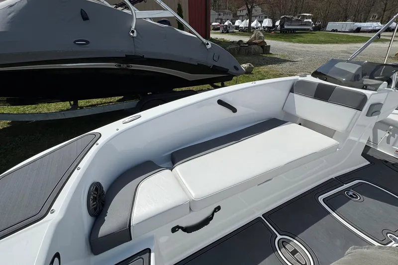 Slide: The Image of 2025 Tahoe T18 boat interior with white seating and modern design. - 11