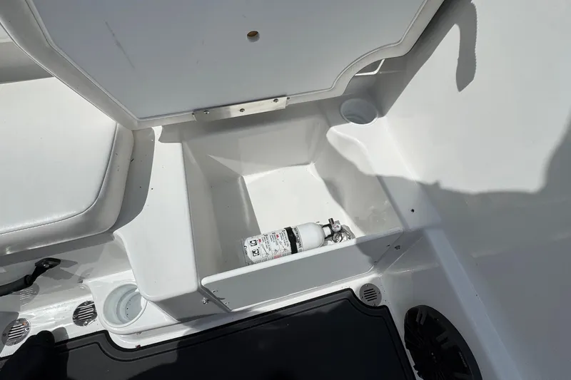 Slide: The Image of Storage compartment in 2025 Tahoe T18 boat with fire extinguisher. - 15