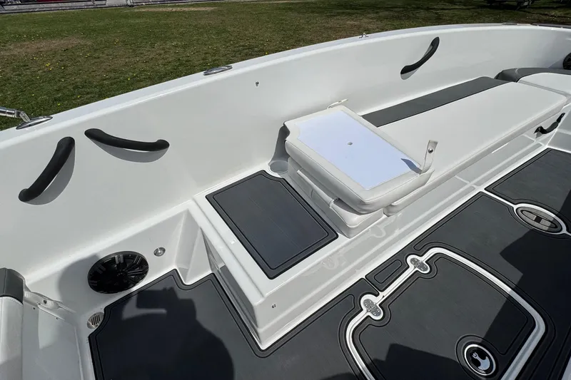 Slide: The Image of 2025 Tahoe T18 boat interior with seating and storage compartments. - 18