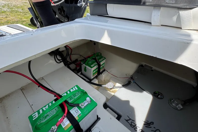 Slide: The Image of 2025 Tahoe T18 boat battery compartment with Interstate batteries and wiring. - 19
