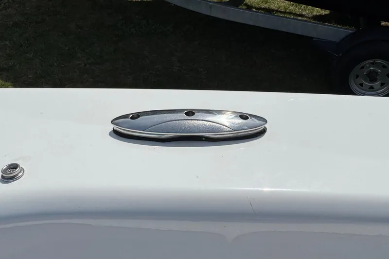 Slide: The Image of 2025 Tahoe T18 boat cleat on white surface, close-up view. - 21
