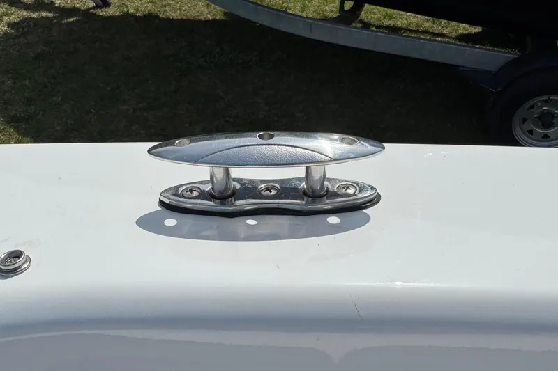 Slide: The Image of 2025 Tahoe T18 boat cleat on white surface, outdoor setting. - 22