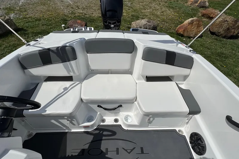 Slide: The Image of 2025 Tahoe T18 boat interior with cushioned seating and modern design. - 7