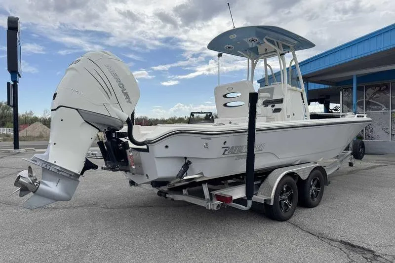 Slide: The Image of 2023 Pathfinder 2600 HPS boat on trailer with Mercury outboard motor. - 7