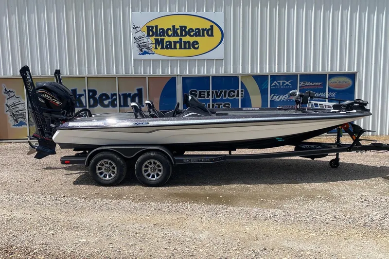 The Image of 2026 Skeeter ZXE20 boat at BlackBeard Marine dealership, side view. - 1