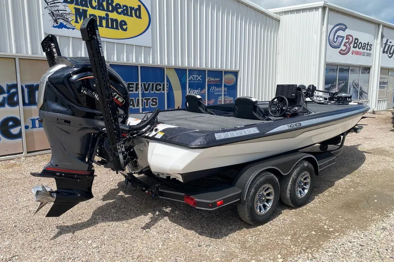 Slide: The Image of 2026 Skeeter ZXE20 boat with Yamaha engine at dealership, displayed on a trailer. - 6