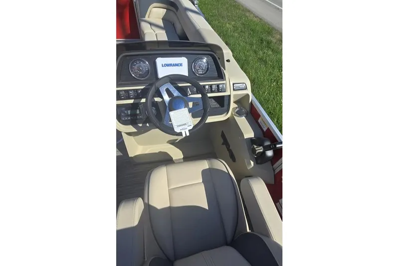 Slide: The Image of Interior view of 2025 Godfrey Sweetwater 2286 SB boat with steering wheel and dashboard. - 5