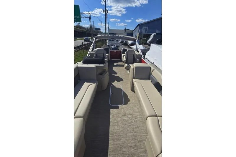 Slide: The Image of 2025 Godfrey Sweetwater 2286 SB pontoon boat with spacious seating and canopy. - 7