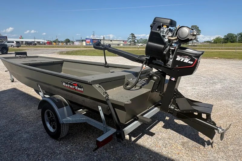 Slide: The Image of 2026 Gator Tail 1748 Gator Series boat with motor on trailer, outdoor setting. - 3